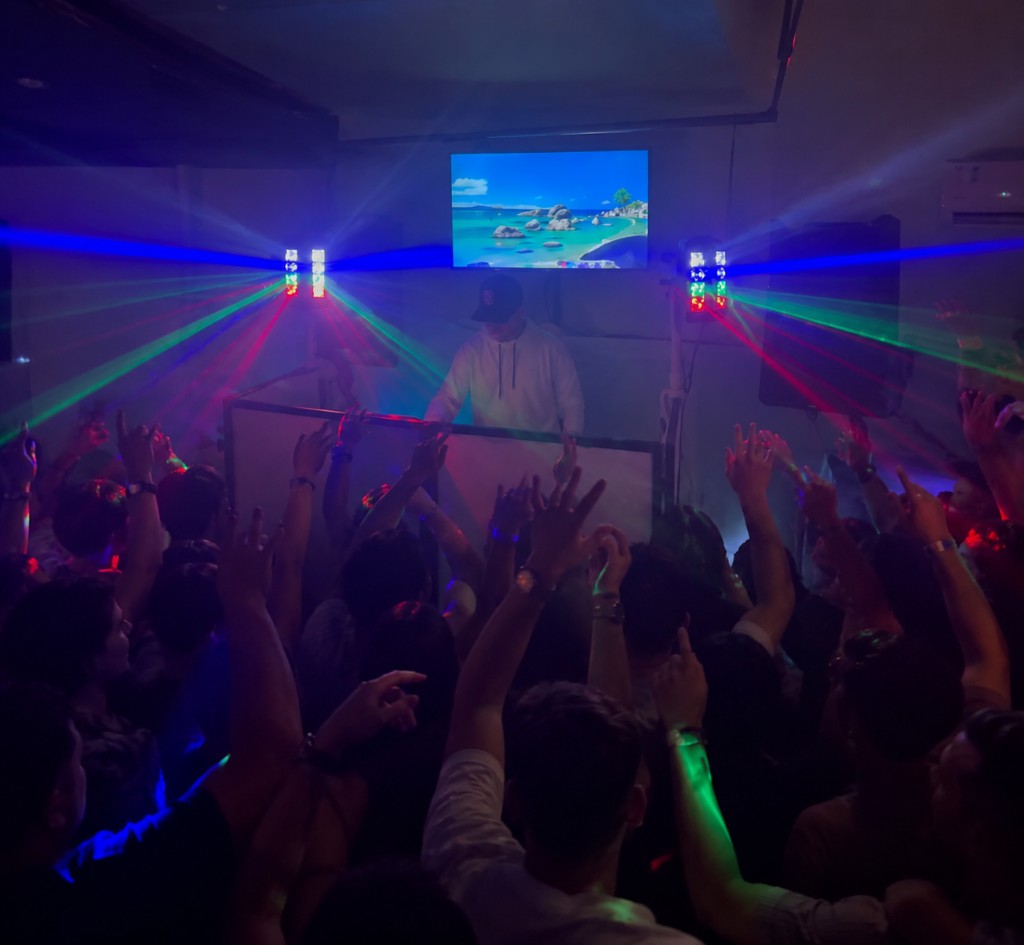 Crowd with lasers at a DJ Aqua party